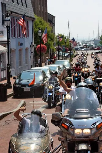 Sgt. Eric & Dad waiving at the cheering crowds on Main St.