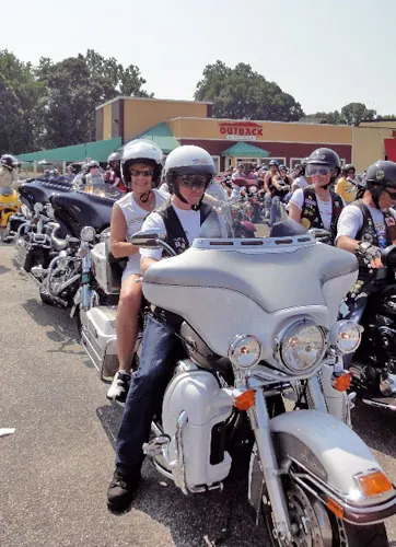 Beth taking her first ride on a Harley in honor of Sgt. Eric Edmundson, on his special day.