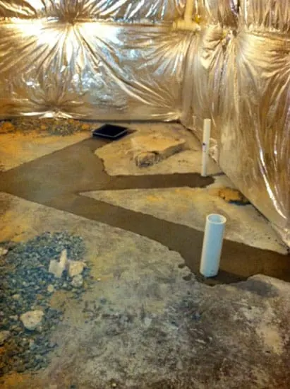 Breaking up the concrete for the plumbing for the bathroom and Man Cave.