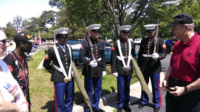 General Allen admires the Marine color guards that came to honor Mark