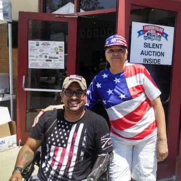 2012 honoree Sgt. Luis Valentine with Janette from Ohio. Janette comes every year. Two great people, folks like them are what makes this USA so great.