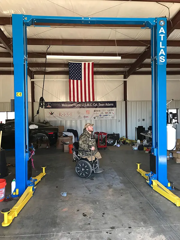 The new 2-post lift Faces of Valor USA purchased for Lance Corporal Sean Adams, now in his shop