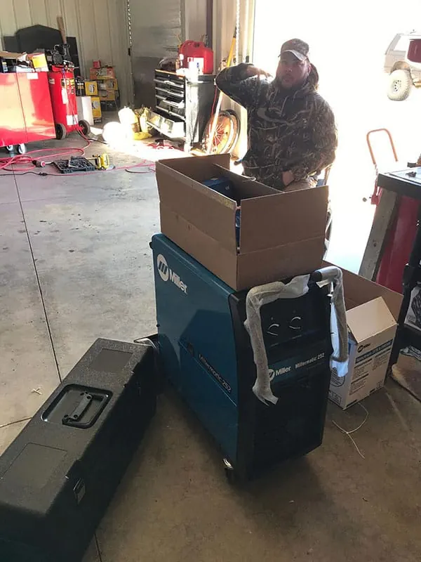 New welder and plasma cutter, Sean is like a kid in a candy store.